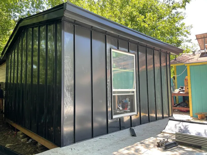 Black standing seam metal wall panels for Roof Inspection in Burkburnett