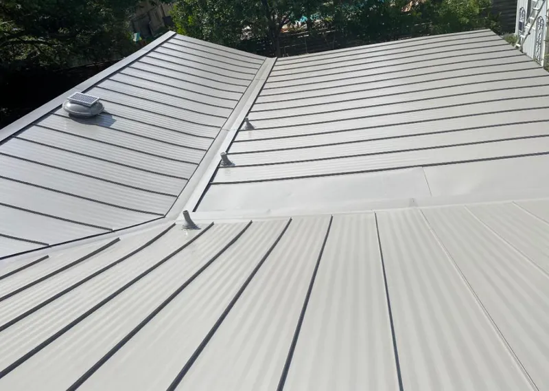 Solar attic fan installed on a metal roof for Roof Ventilation in Burkburnett